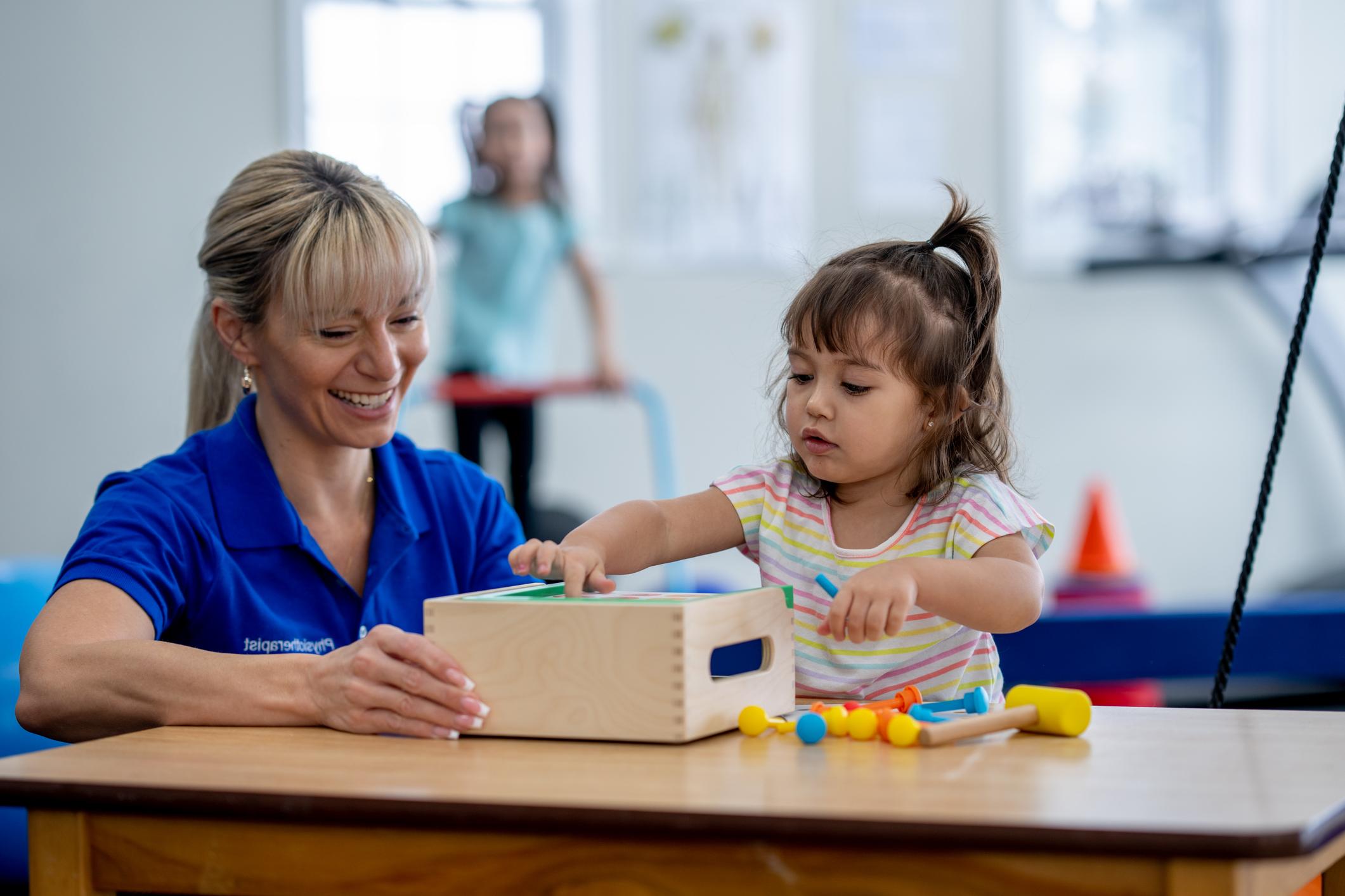 therapist helping child