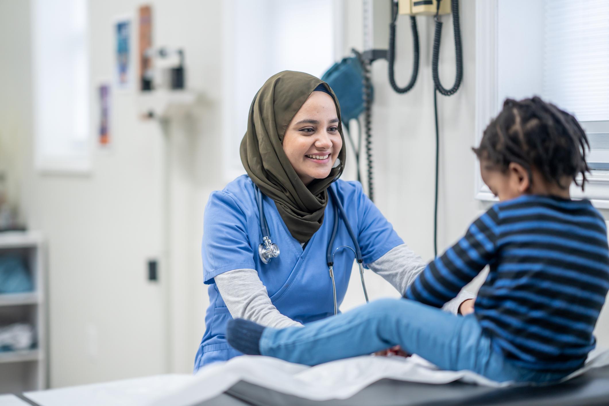 Nurse helping child patient